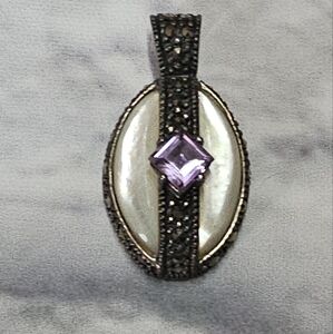 Elegant Silver and Purple Brooch